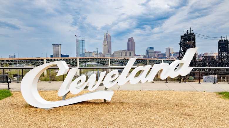 "Cleveland" sign with city skyline in the background