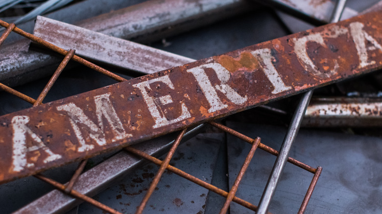 Rusted sign that reads 