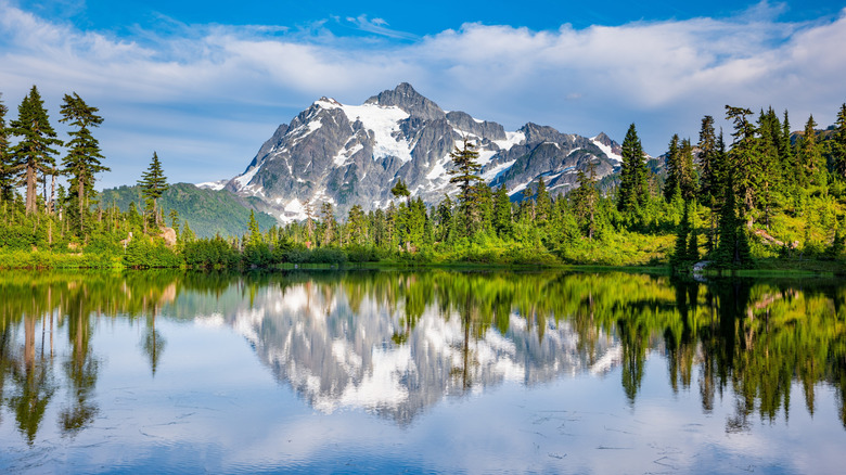 A clear lake and Cascade Mountains on a sunny day
