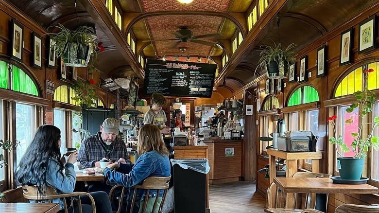 Interiors of the cafe with three patrons seated