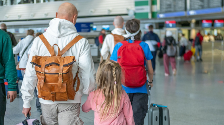 People walking through an airport