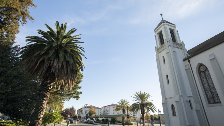 A Spanish-style historic house and palm trees in Downtown San Leandro.