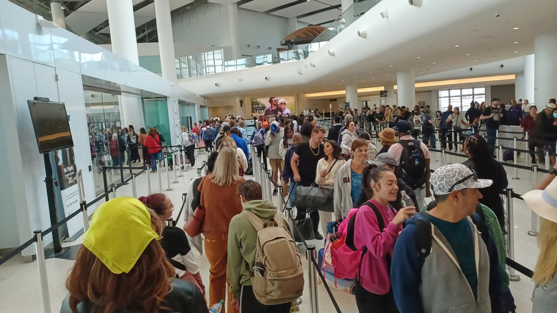 People waiting in line at an airport