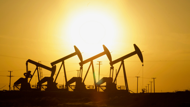 Silhouette of oil field pump jacks at sunset near Bakersfield California