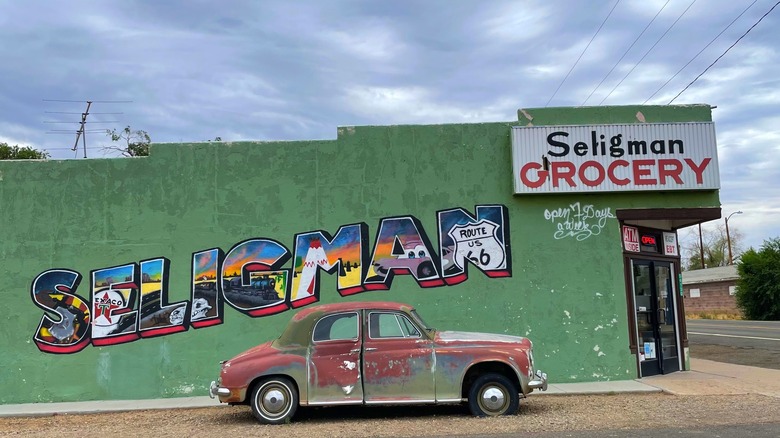 Seligman, AZ sign and old car