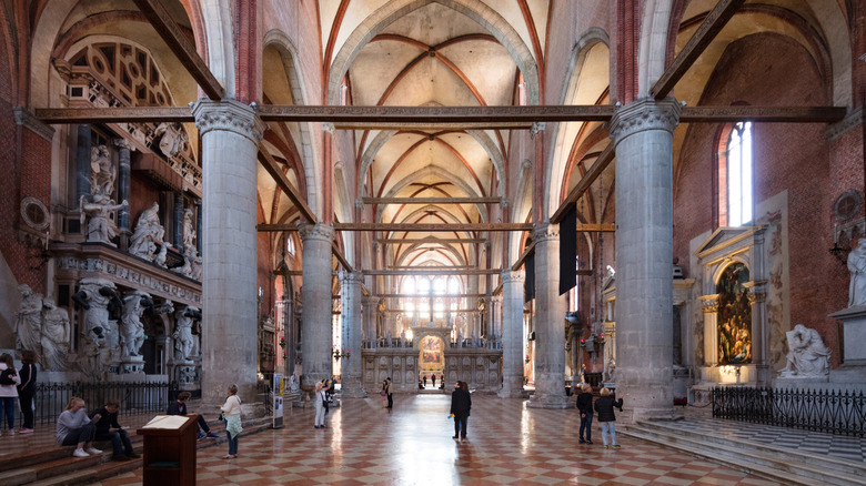 Tourists wandering around a gothic cathedral