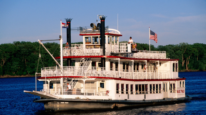 A steamboat glides riding on the Mississippi River in Hannibal, Missouri