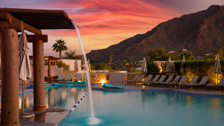 Luxury resort pool in Arizona with a mountain and sunset