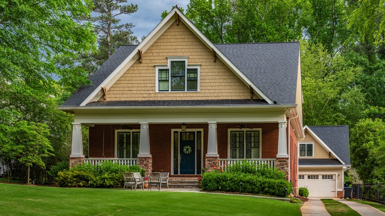 a single family home with a lush lawn