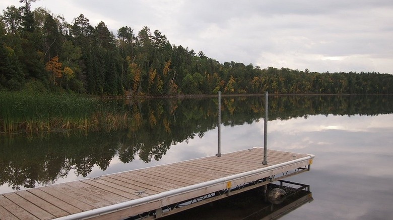 A wooden dock stretches out over LaSalle Lake in northern Minnesota.