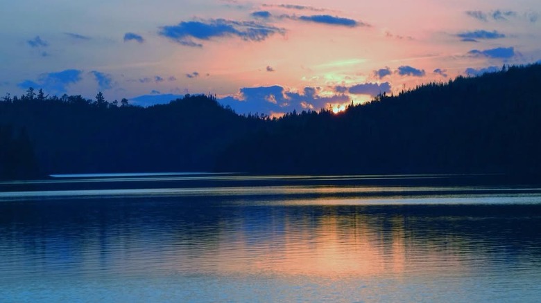 Sunset over Loon Lake in Northern Minnesota, with trees in the background