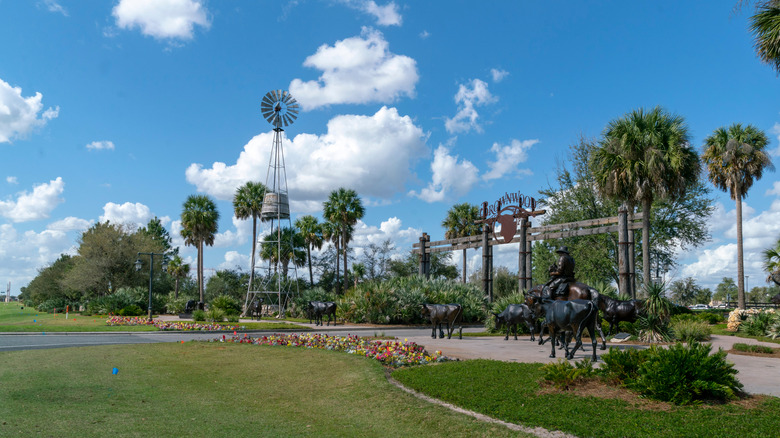Brownwood old Florida-themed community entrance with bronze statues in Wildwood, Florida