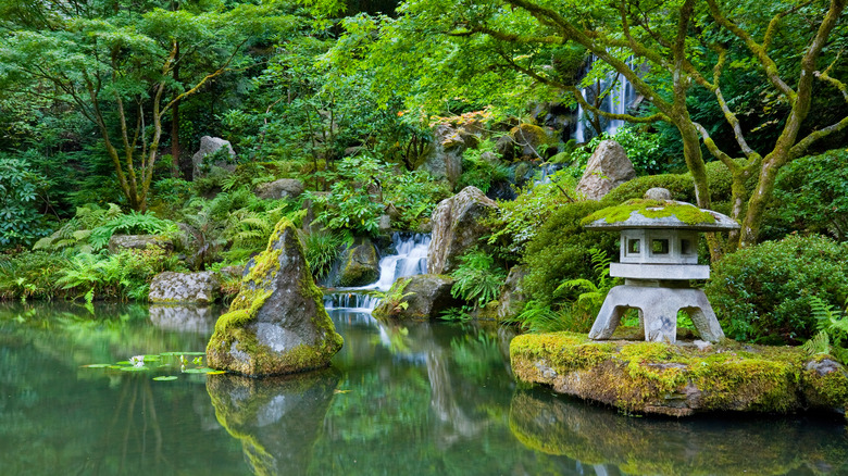 A waterfall tumbling into a pond in Portland Japanese Garden