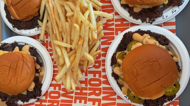 four burgers and fries from For the Win
