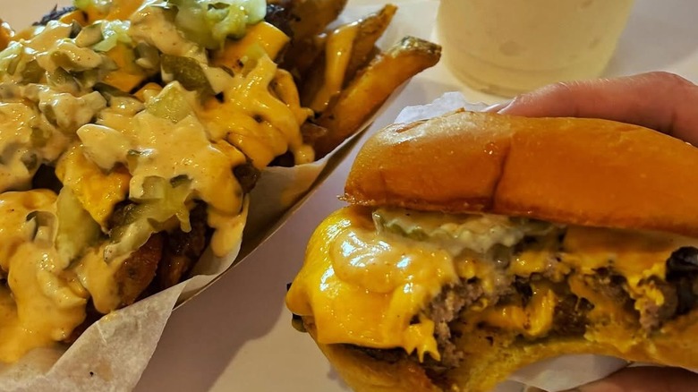 smash burger with bite and loaded fries from Proudly erving