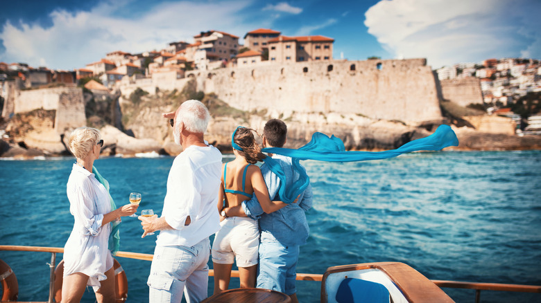 Older couple and younger couple on a boat near the coast of Croatia