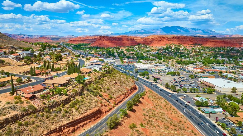 Aerial view of streets in St. George, Utah with red mountains in background
