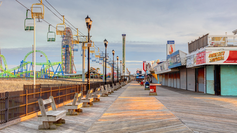 Daytime view of the Casino Pier and shops on the boardwalk along the beach at Seaside Heights