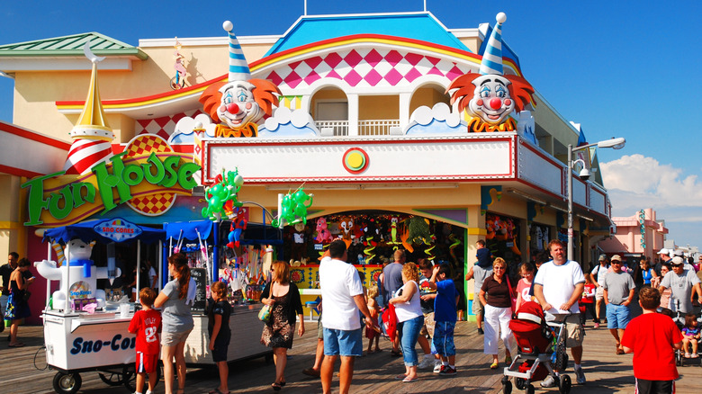 A large crowd of people walking on the boardwalk in Point Pleasant, New Jersey