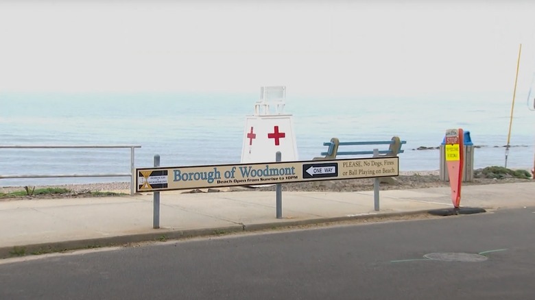 Woodmont sign in front of the water at the beach in Milford, Connecticut