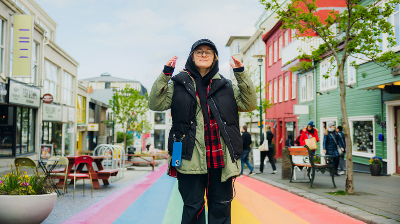 Woman in rainbow crosswalk