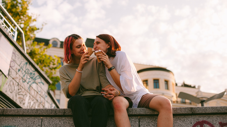 Two women share ice cream