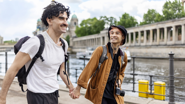 Two men holding hands