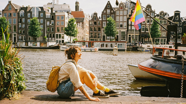 Woman sitting on dock