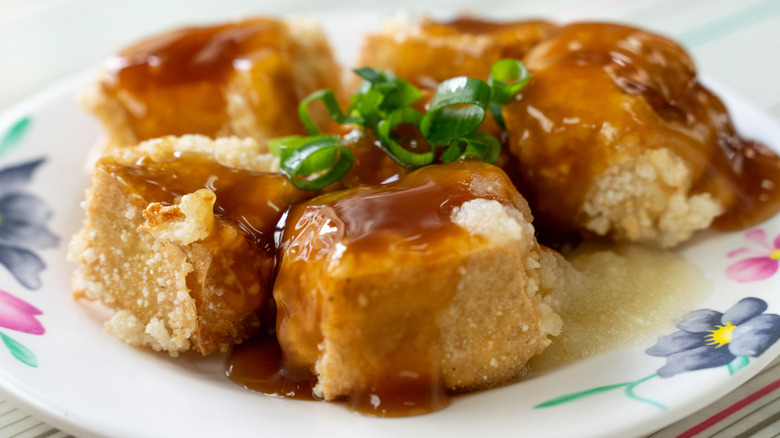 Cubes of stinky tofu on a plate