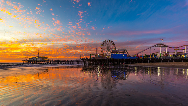 Pier at sunset standing in the water. Santa Monica Pier, California