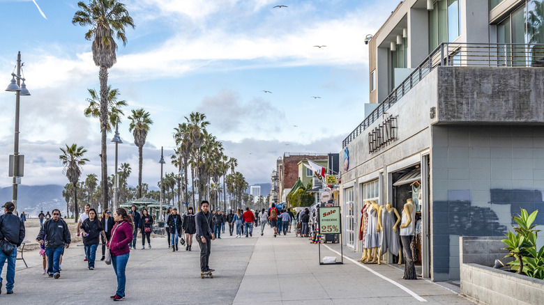 Venice Beach boardwalk with crowds and ocean front walk shops