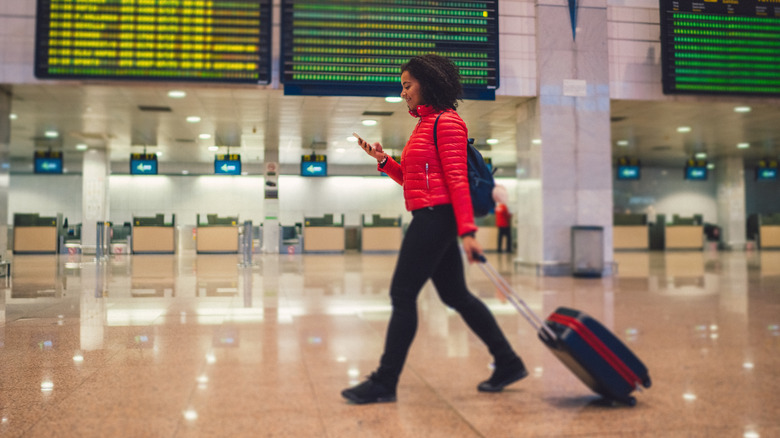 Woman walking through airport