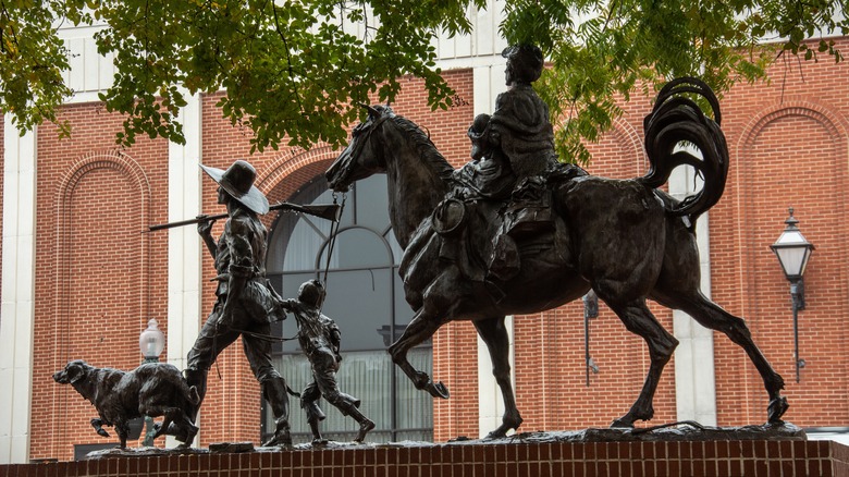 A statue memorializing pioneer families in downtown Nacogdoches