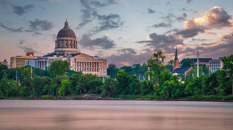Jefferson City with the Missouri River and State Capitol in background during sunset