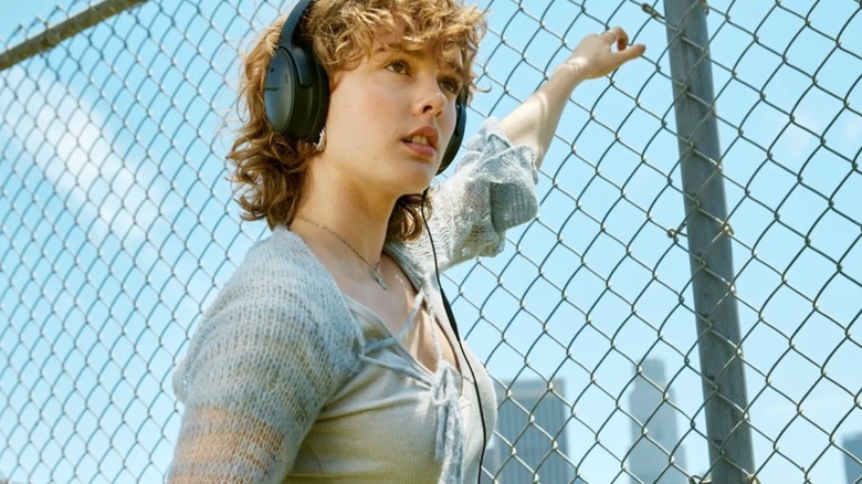 Girl wearing Bose QuietComfort SC Noise Canceling Headphones