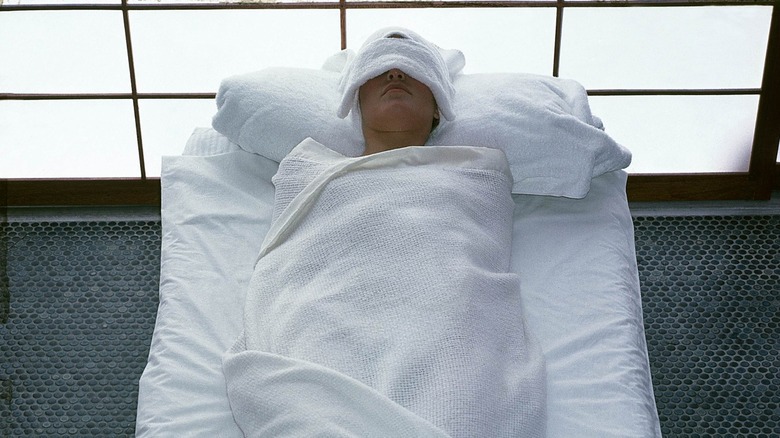 A guest enjoying a body wrap at Golden Door