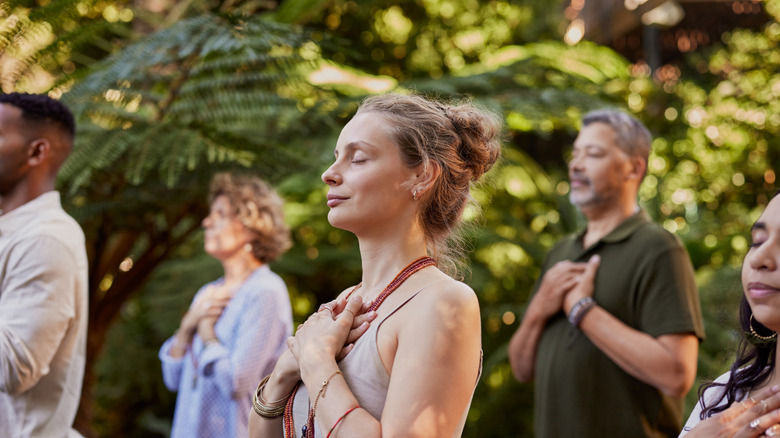 People meditating in a wellness retreat
