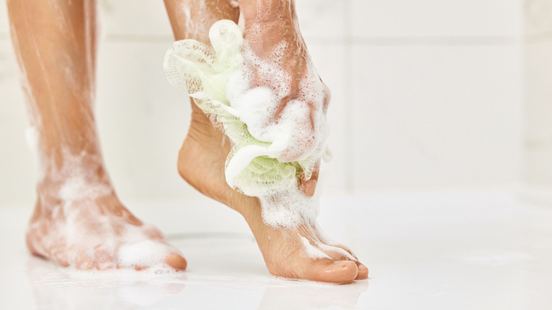 Person washing their feet in the shower