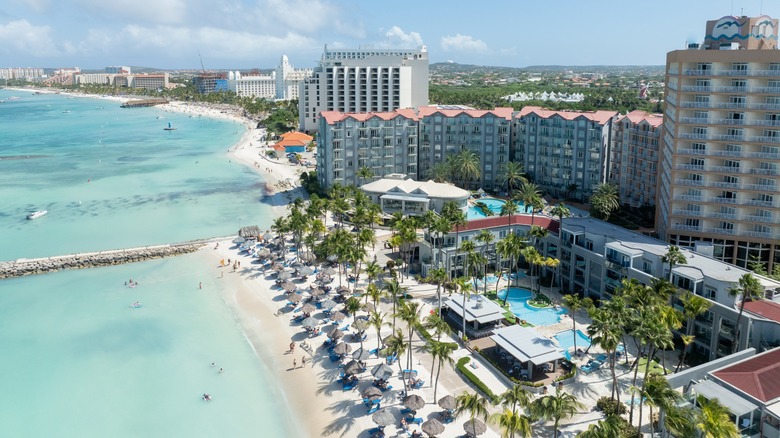 Aerial view of the coast of Aruba with resorts lining the beach