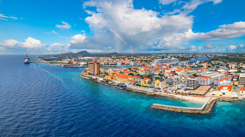 The busy Willemstad harbor front with clear waters
