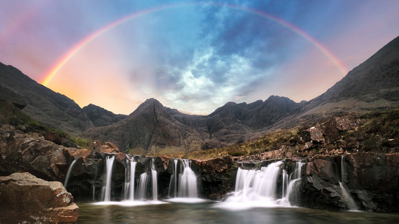 A rainbow over a waterfall on the Isle of Skye