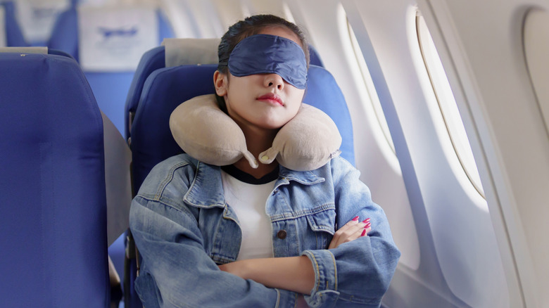 Passenger sleeping on plane