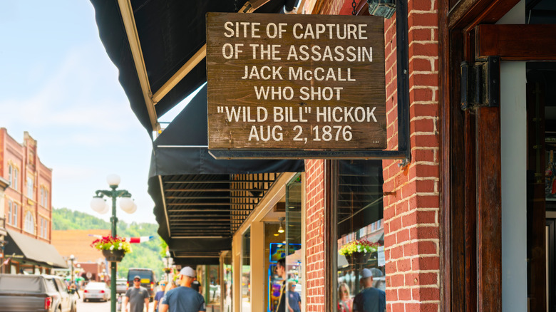Wooden sign marking the spot where Wild Bill's assassin was caught