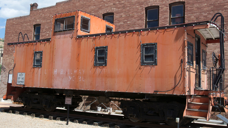 An orange colored train car in Helper, Utah