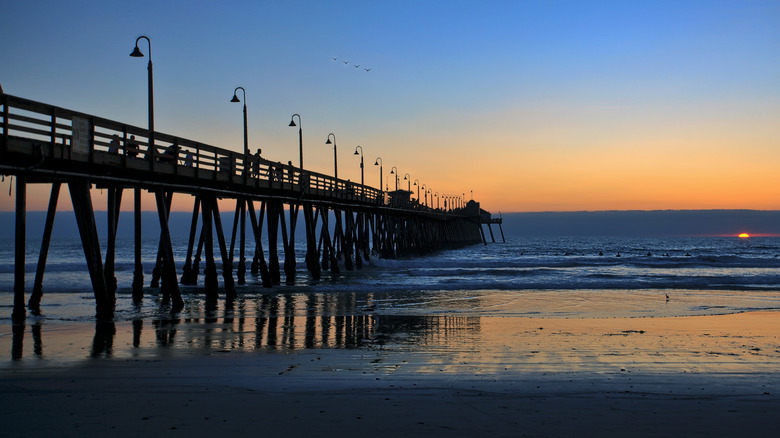 The Imperial Beach pier at beachfront during sunset
