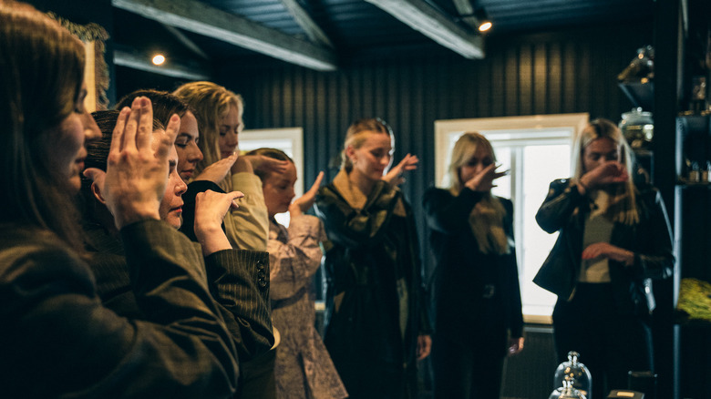 Visitors on a guided scent journey, featuring various perfumes and an Icelandic schnapps tasting, at Fischersund, an artisanal fragrance shop, in downtown Reykjavík, Iceland