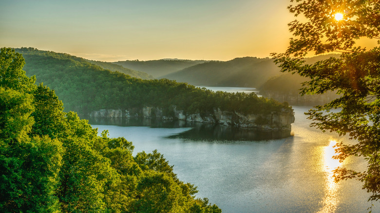 The setting sun glimmering over Summersville lake, West Virginia
