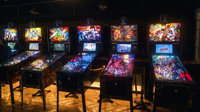 A row of vintage pinball machines