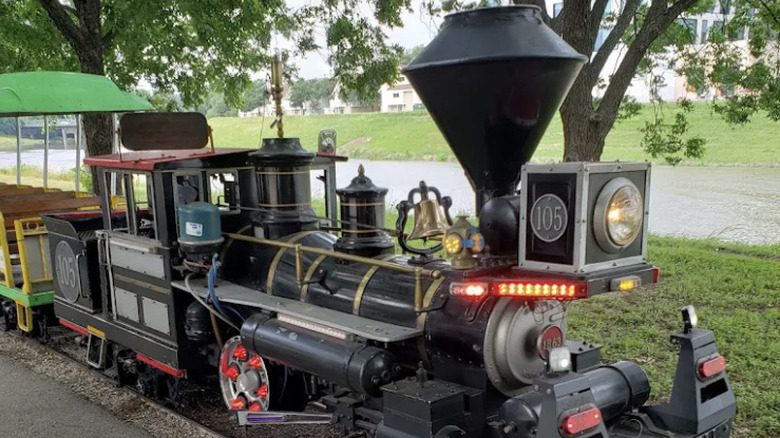Close-up of vintage black train car at Forest Park Miniature Railroad attraction in Dallas, Texas