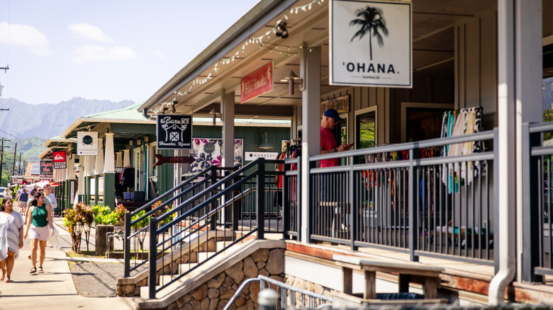 Hanalei, Hawai'i US - February 17, 2024: downtown Hanalei, with people strolling along stopping into shops and restaurants